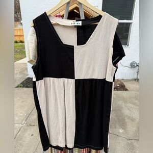 Elegant Black and Cream Sleeveless Top